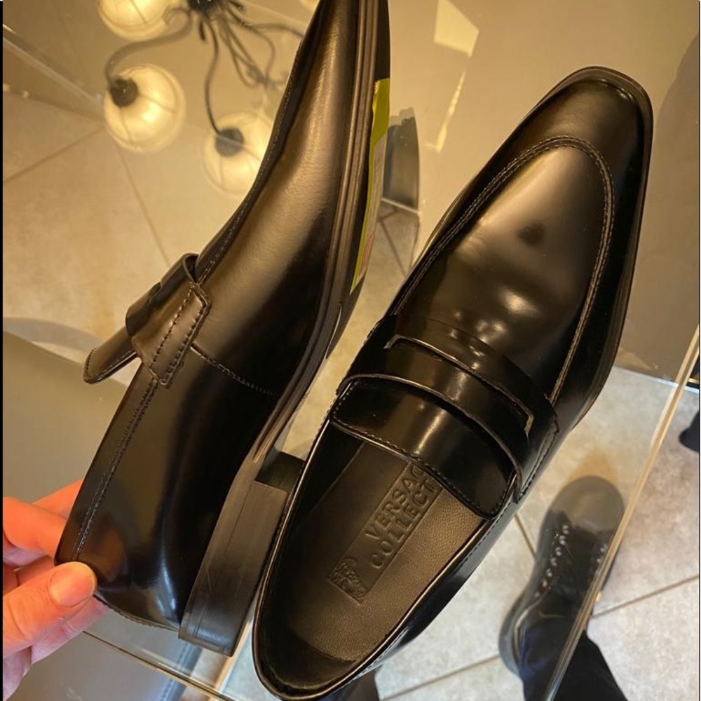 Versace collection. Black penny. Never worn .